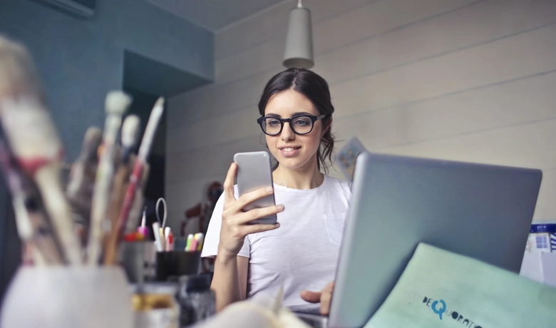 Woman using social network on cell phone