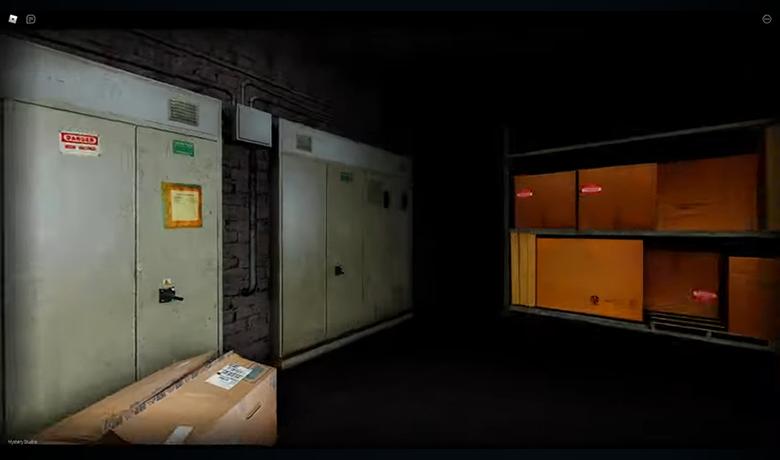 In-game screenshot showing an empty room with lockers and a cardboard box.