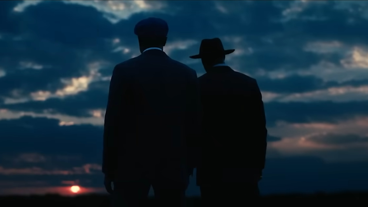 Image and two characters with their backs turned looking at the horizon
