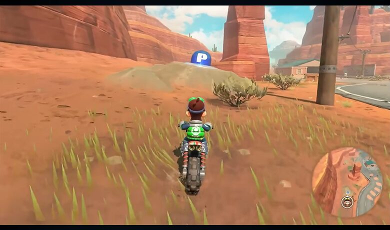 Tangkapan layar salah satu game konsol yang menunjukkan karakter di atas sepeda motor di tengah alam